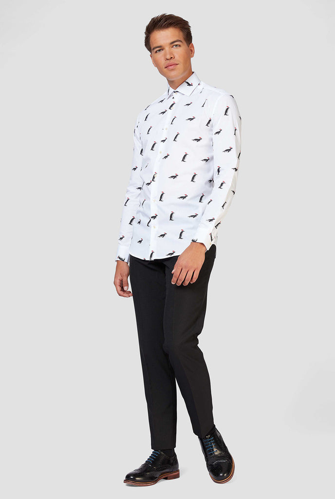 Man wearing white dress shirt with Christmas penguins