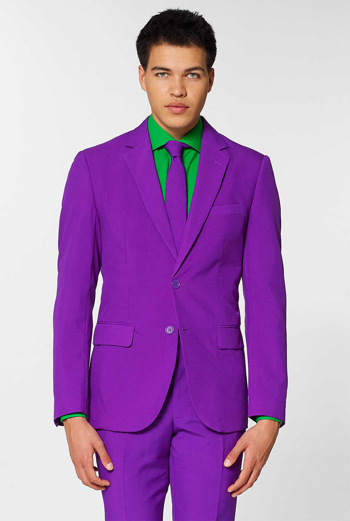 Man wearing purple men's suit and green dress shirt