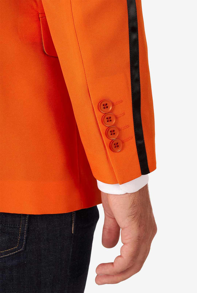 Man wearing orange blazer with dutch lion