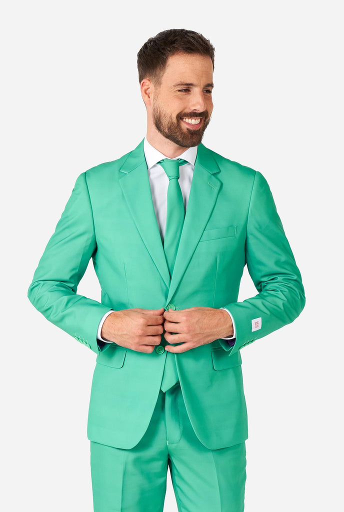 Man wearing turquoise colored suit