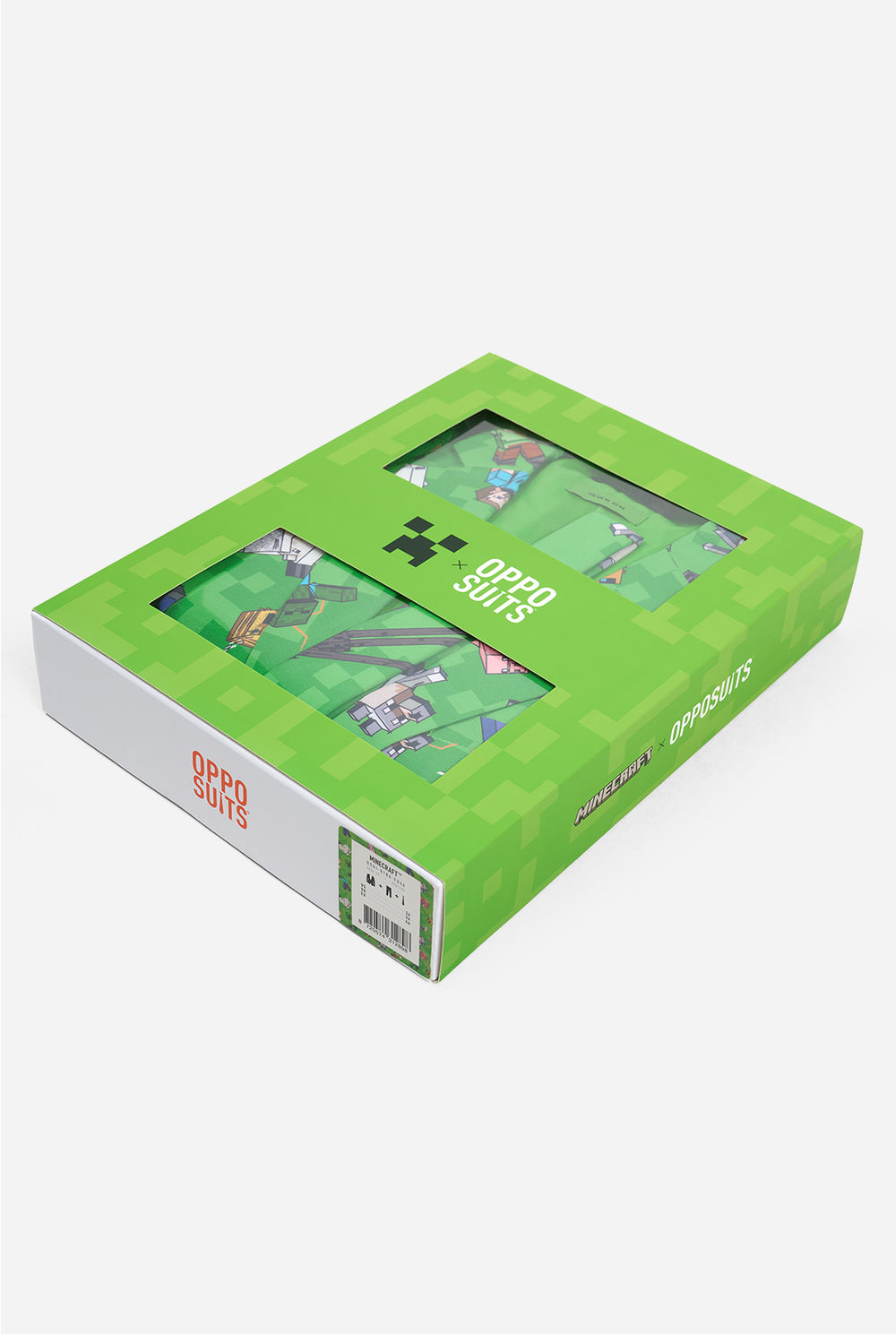 Green box with a transparent window showingthe minecraft x opposuits boxsuit on a white background