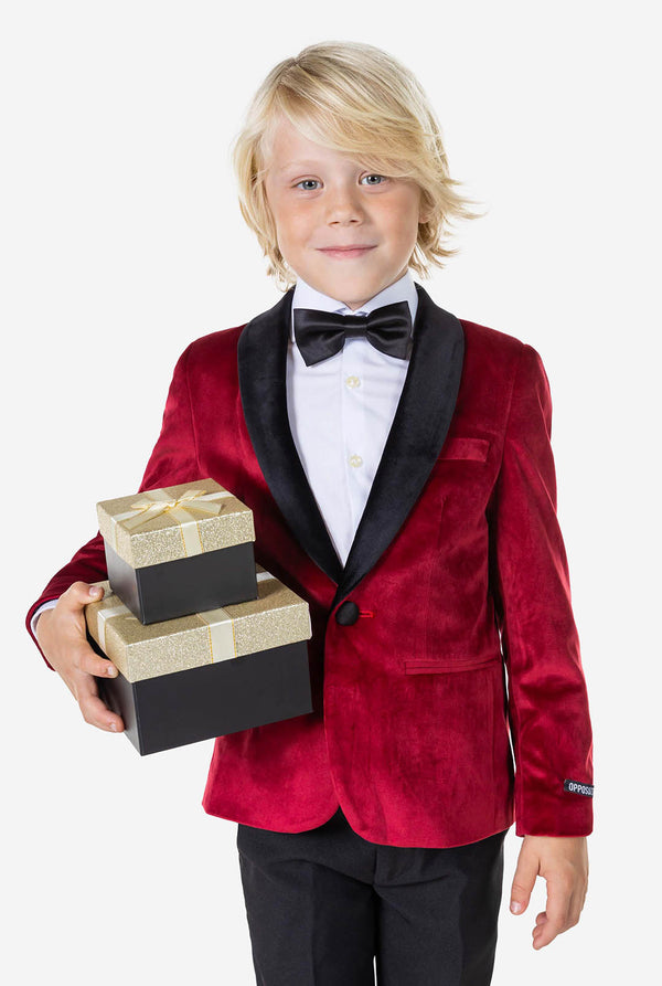 Boy wearing red velvet dinner jacket