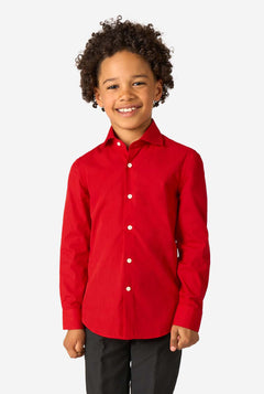 Little kid is wearing a red shirt and a black pants.