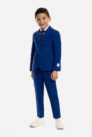 Young boy wearing a blue suit with a white background