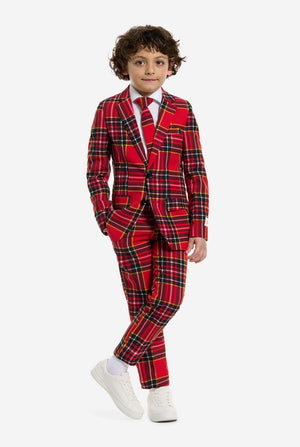 Child wearing a red plaid suit on a white background