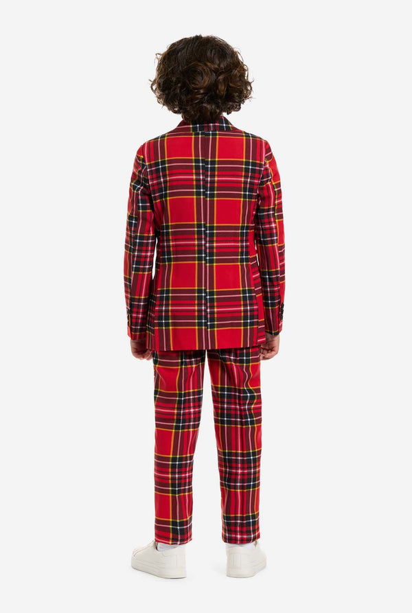 Person wearing a red plaid outfit on a white background