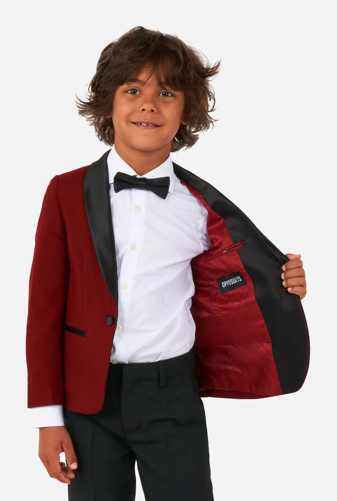 Boy wearing red and black tuxedo