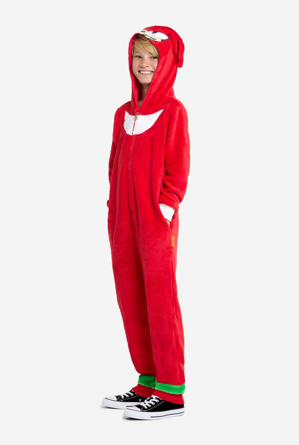 A child wearing the Knuckles onesie with the hood on his head, showing the face of the Knuckles Onesie. Full Body image