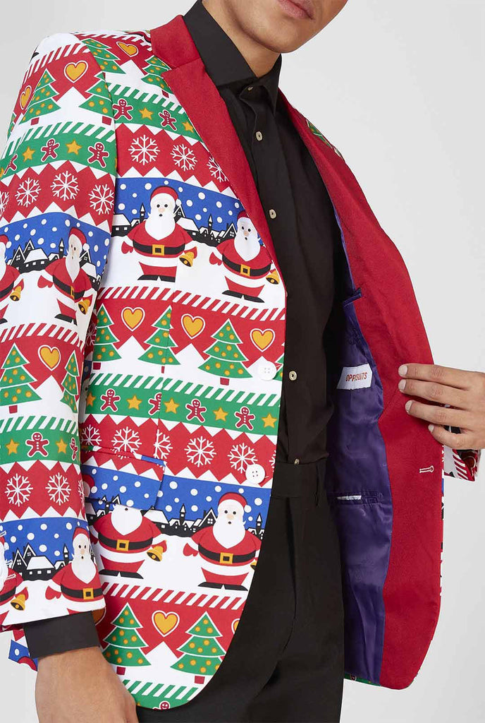 Red Ugly Christmas sweater print blazer worn by man zoomed in