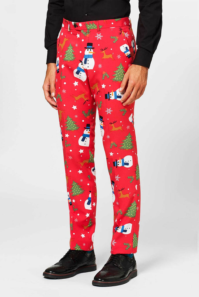 Man wearing red pants with Christmas icons 