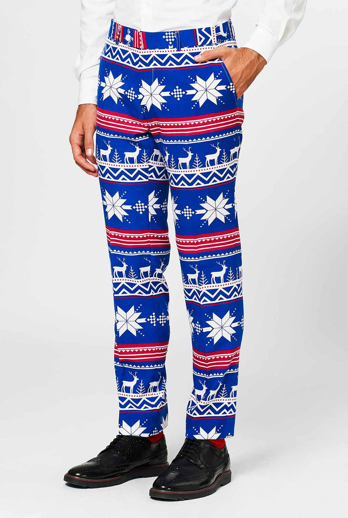 Man wearing blue pants with Nordic Christmas icons