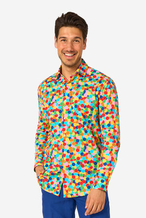 Man wearing a colorful polka dot confetti shirt on a white background