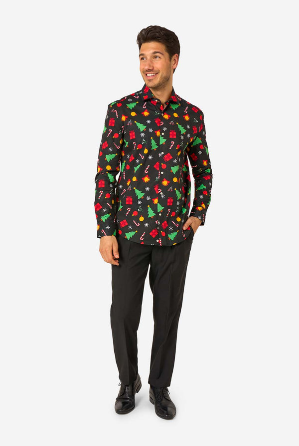 Man wearing a colorful patterned black shirt and black pants on a white background