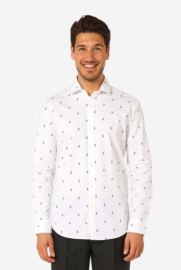 Man wearing a white shirt with a subtle Christmas tree pattern on a white background.