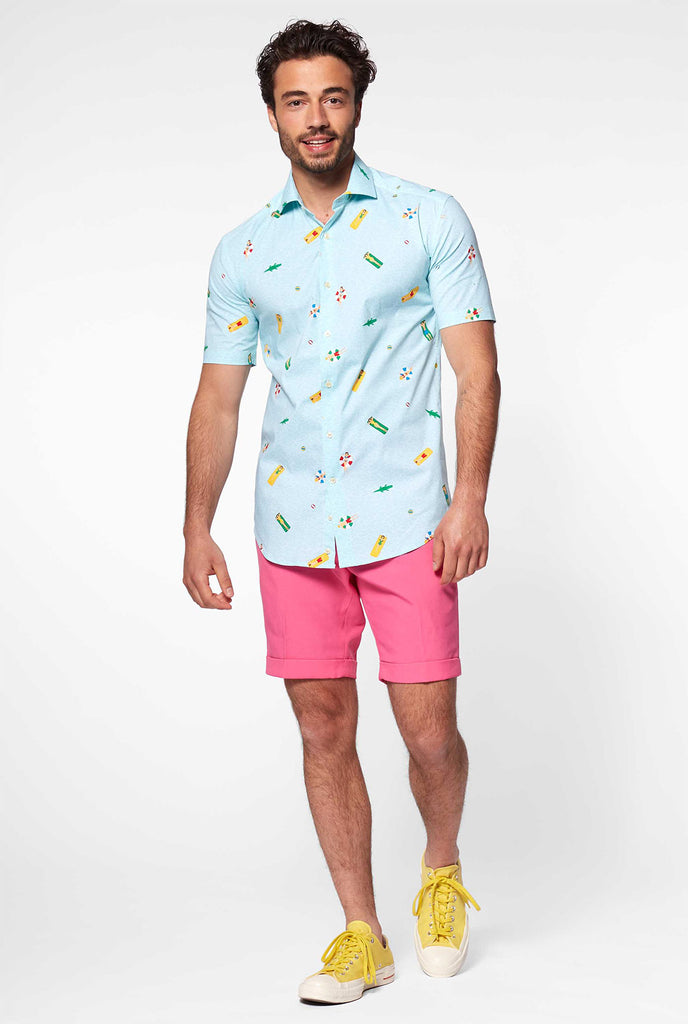 Man wearing light blue short sleeve shirt with pool icons