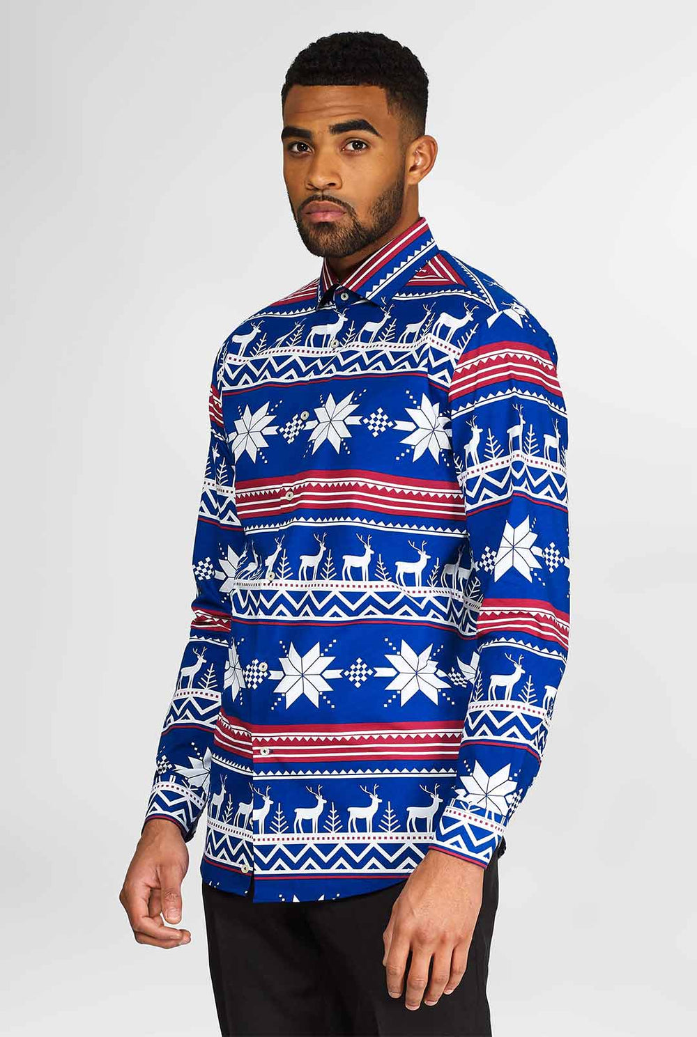 Man wearing blue dress shirt with Nordic Christmas theme