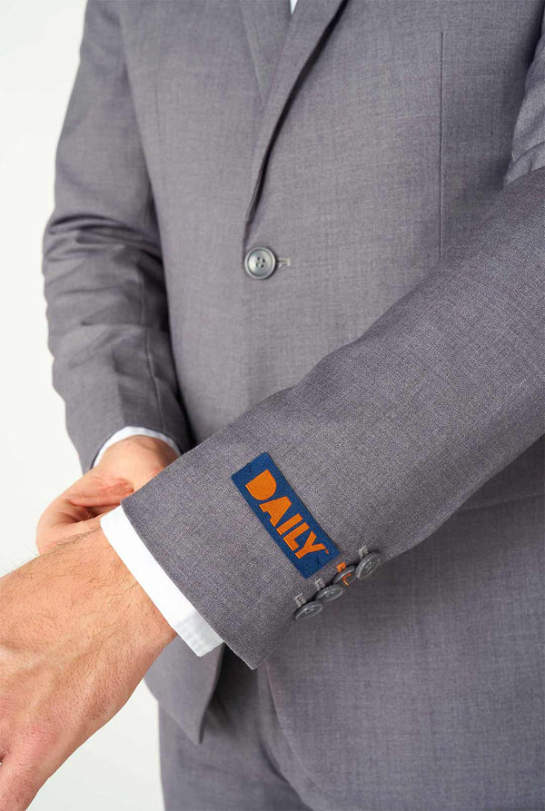 Man wearing casual grey business suit