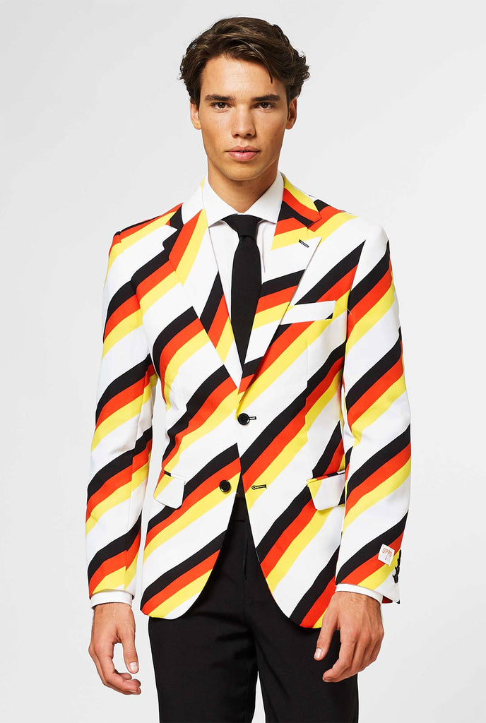 Man wearing German flag colored suit