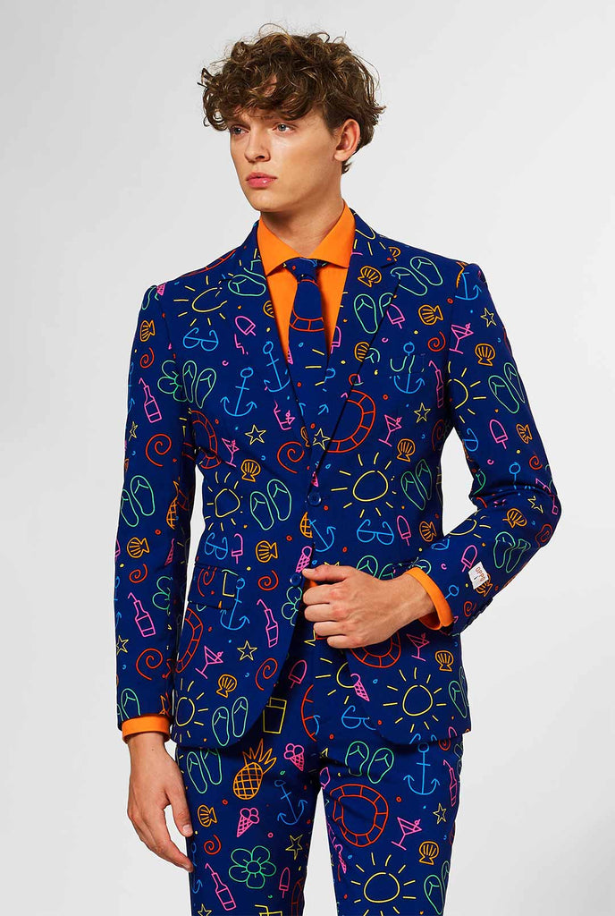 Dark blue men's  suit with bright doodle iconography worn by man