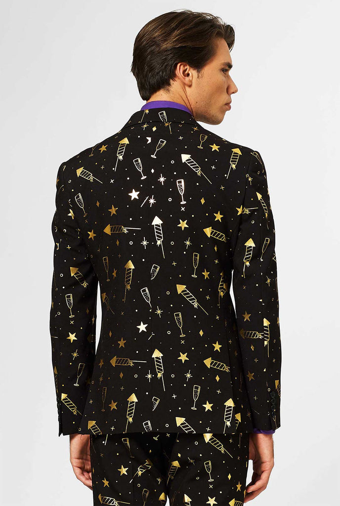 Black men's suit with golden fireworks print worn by man