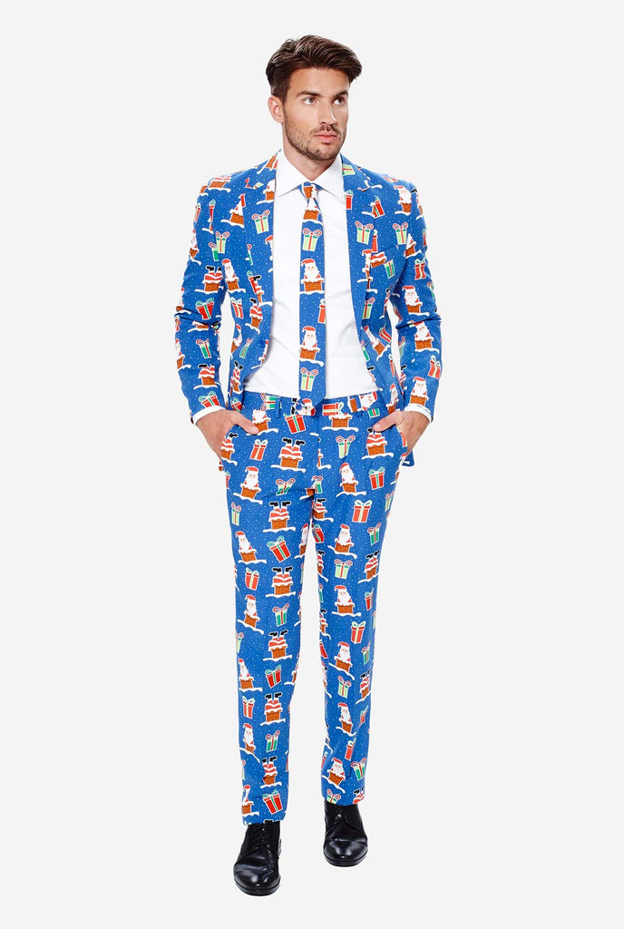 Man wearing blue Christmas suit with Christmas icons
