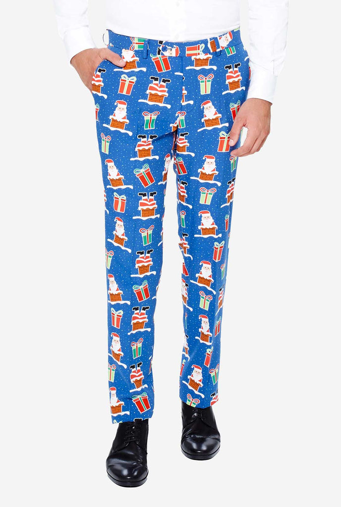 Man wearing blue Christmas suit with Christmas icons