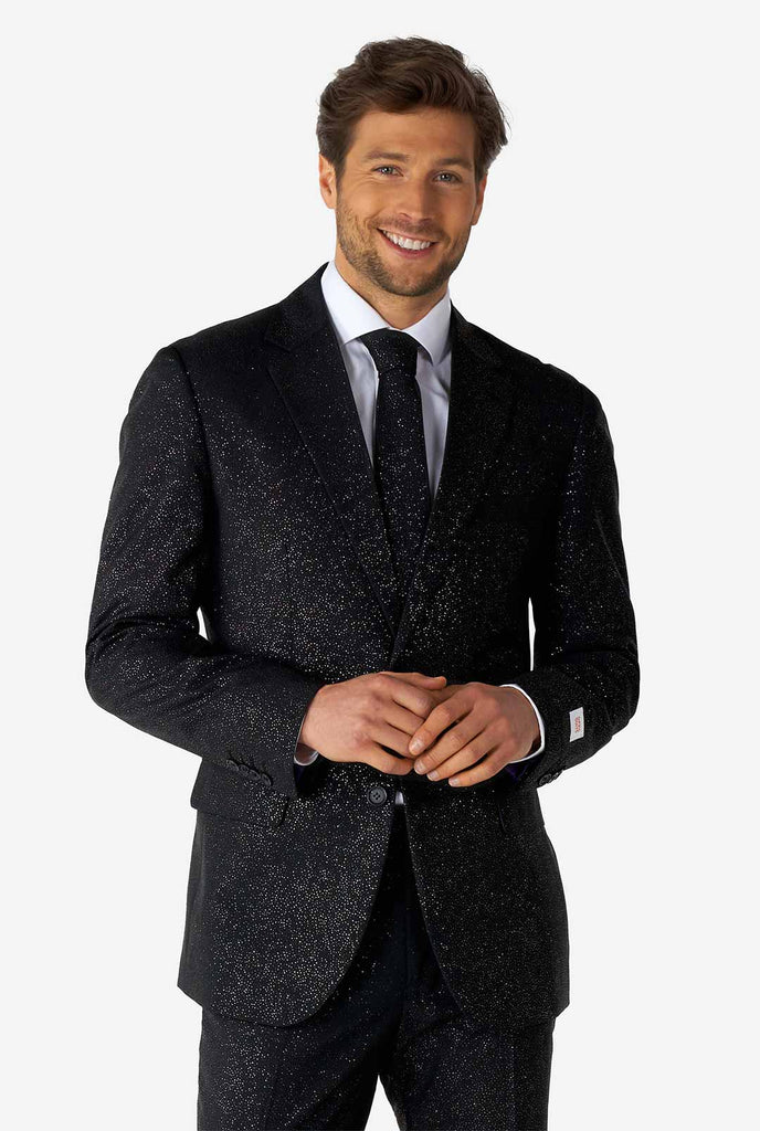 Man wearing black suit with glitter