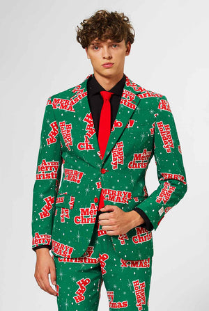 Man wearing green Christmas suit with red Christmas phrases