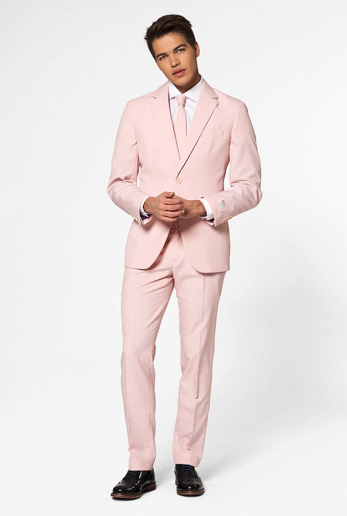 Man wearing pastel pink colored men's suit
