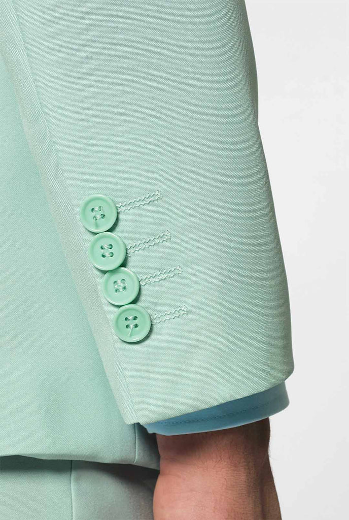 Man wearing pastel mint green colored men's suit, sleeve close up