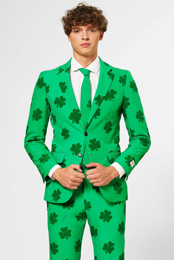 Man wearing green St. Patrick's Day men's suit, with clover print