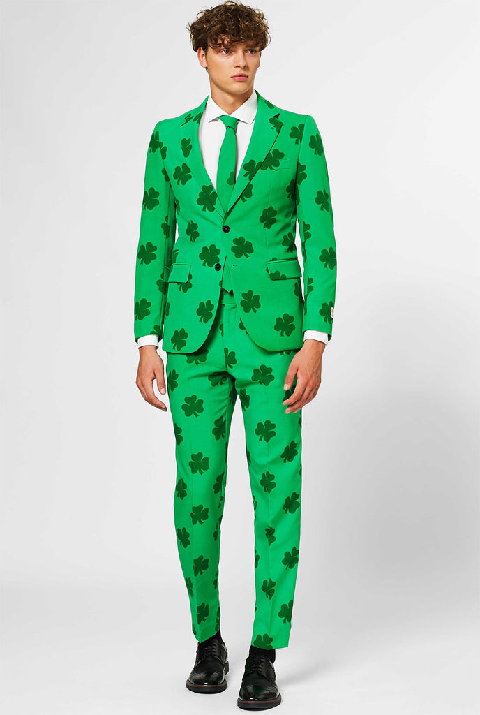 Man wearing green St. Patrick's Day men's suit, with clover print