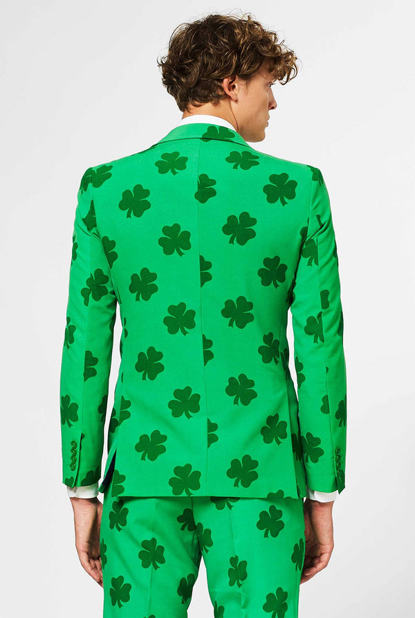 Man wearing green St. Patrick's Day men's suit, with clover print
