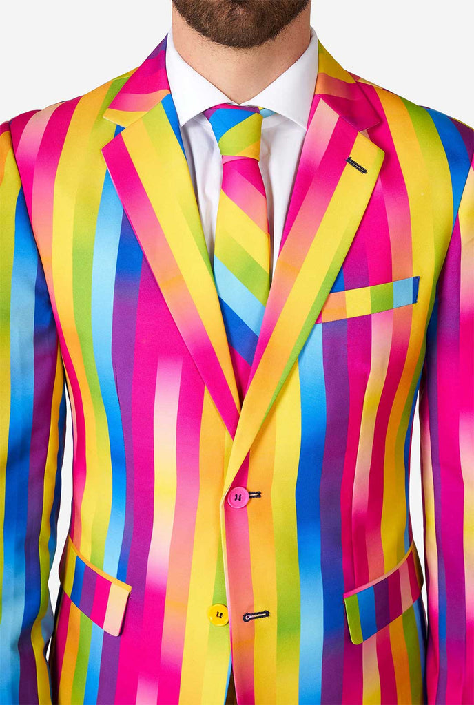 Man wearing rainbow-colored suit