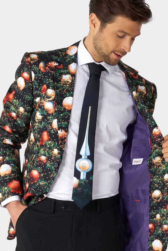 Man wearing Christmas suit with Christmas tree print