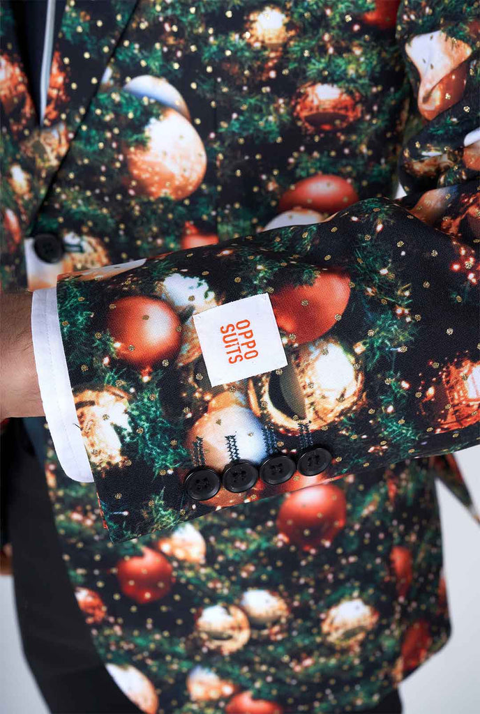 Man wearing Christmas suit with Christmas tree print