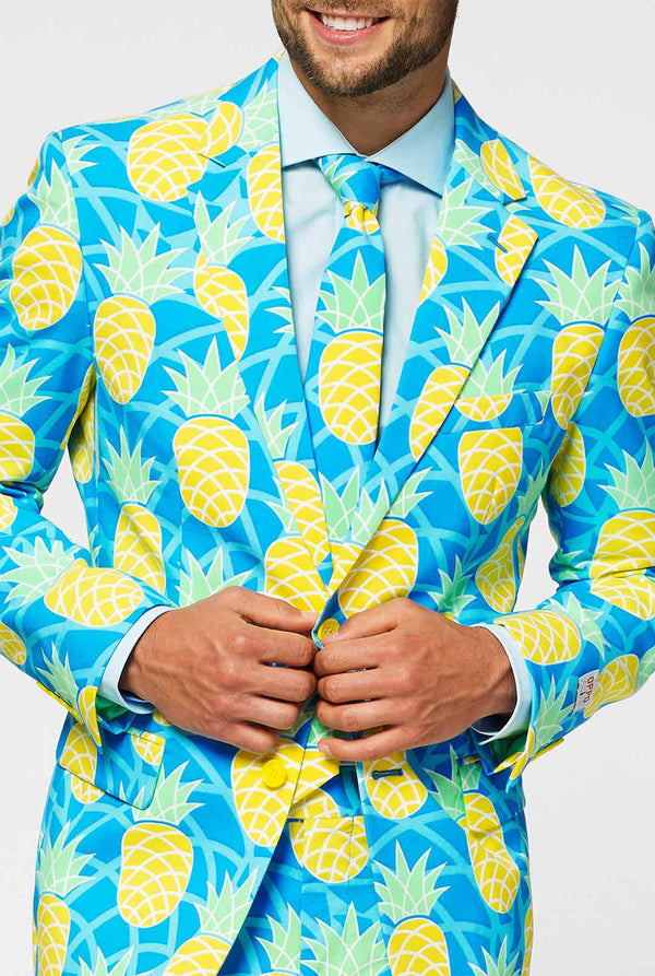Pineapple print men's suit with bright colors by man close up
