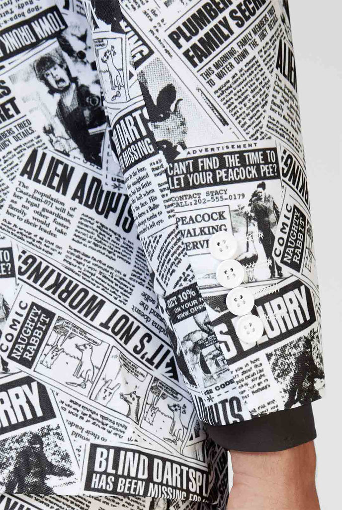 Funny newspaper print men's suit Textile Telegraph worn by man zoomed in