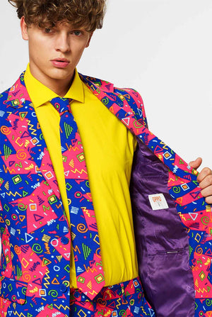 Funky pink and blue men's suit with abstract icons worn by man