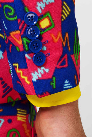 Funky pink and blue men's suit with abstract icons worn by man