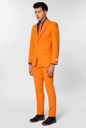 Man wearing orange men's suit with purple dress shirt