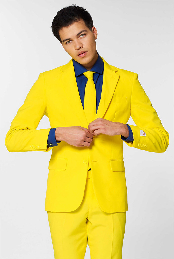 Man wearing yellow men's suit and dark blue dress shirt