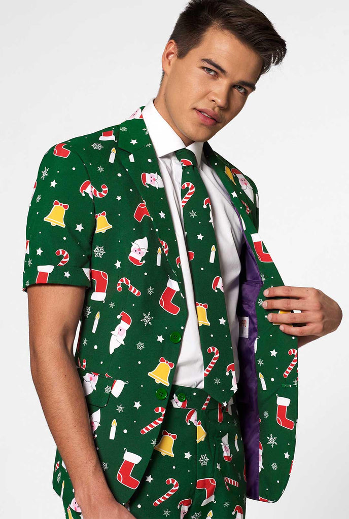 Man wearing green Christmas summer suit, consisting of shorts, jacket and tie