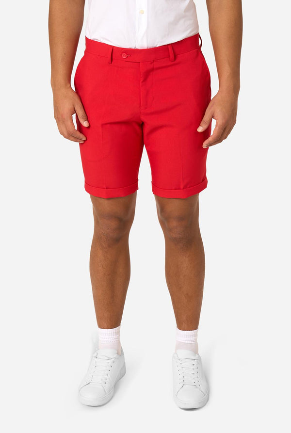 Person white shirt, and red shorts on a white background