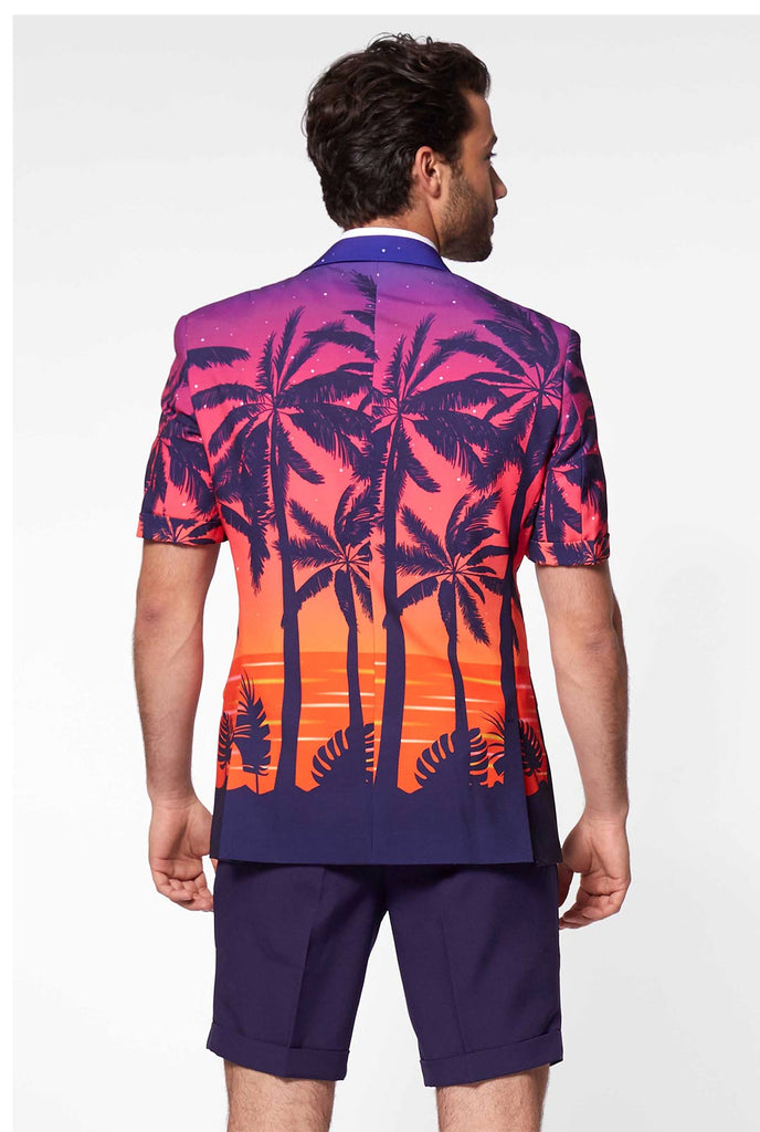 Man wearing summer suit with palms and sunset print