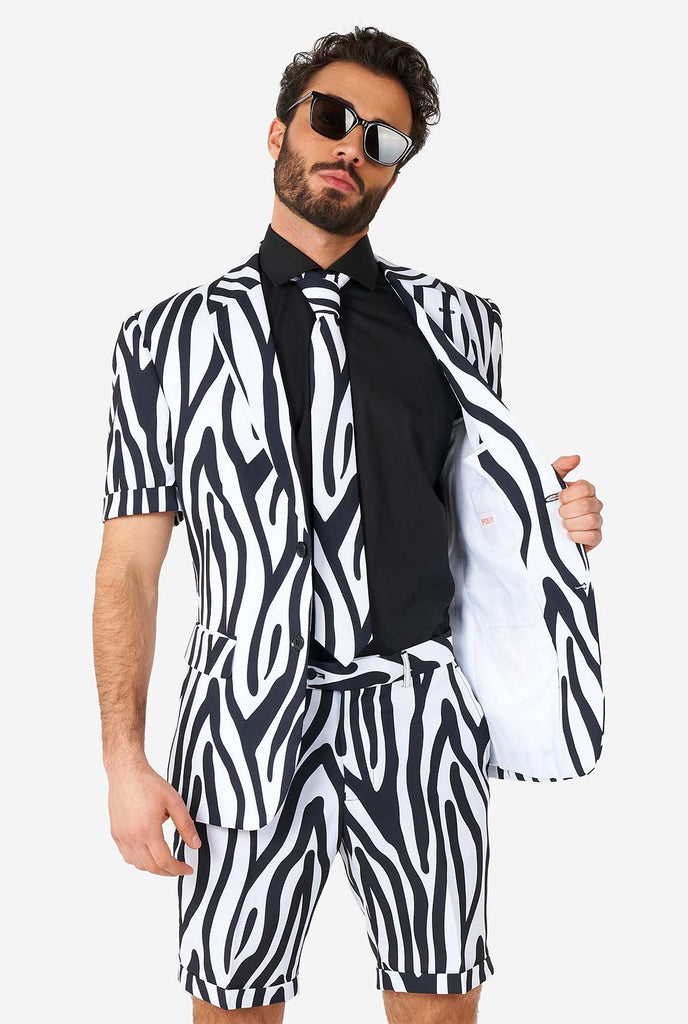Man wearing summer suit with black and white zebra stripes