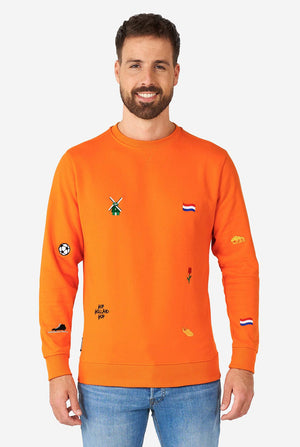 Man wearing orange sweater with Dutch icons