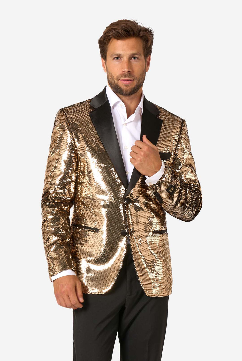 Man wearing a gold sequin blazer with black lapels on a white background