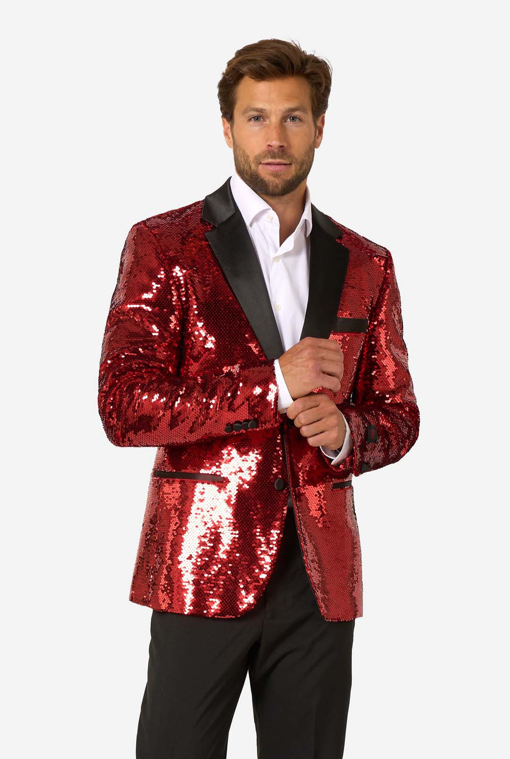 Man wearing a red sequin blazer with black lapels on a white background