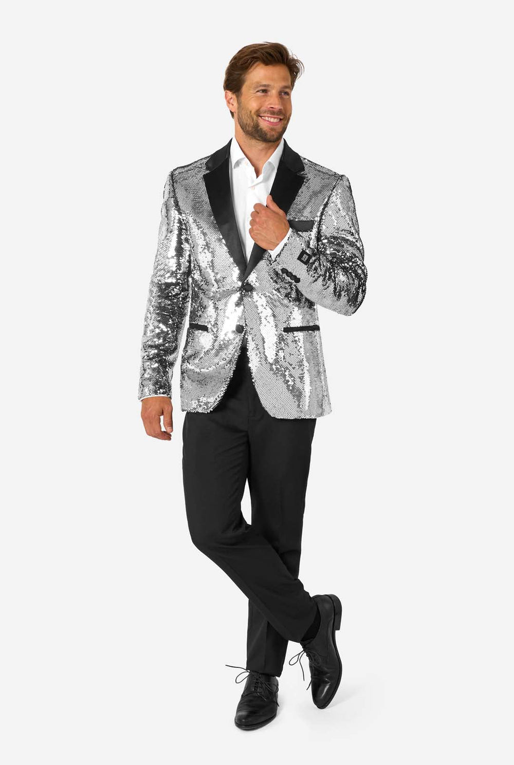 Man wearing a silver sequin blazer with black lapels on a white background